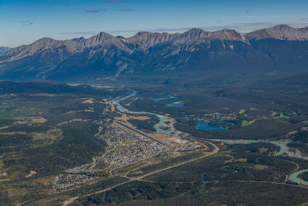 Aerial Photography of a Town Near Water and Mountains